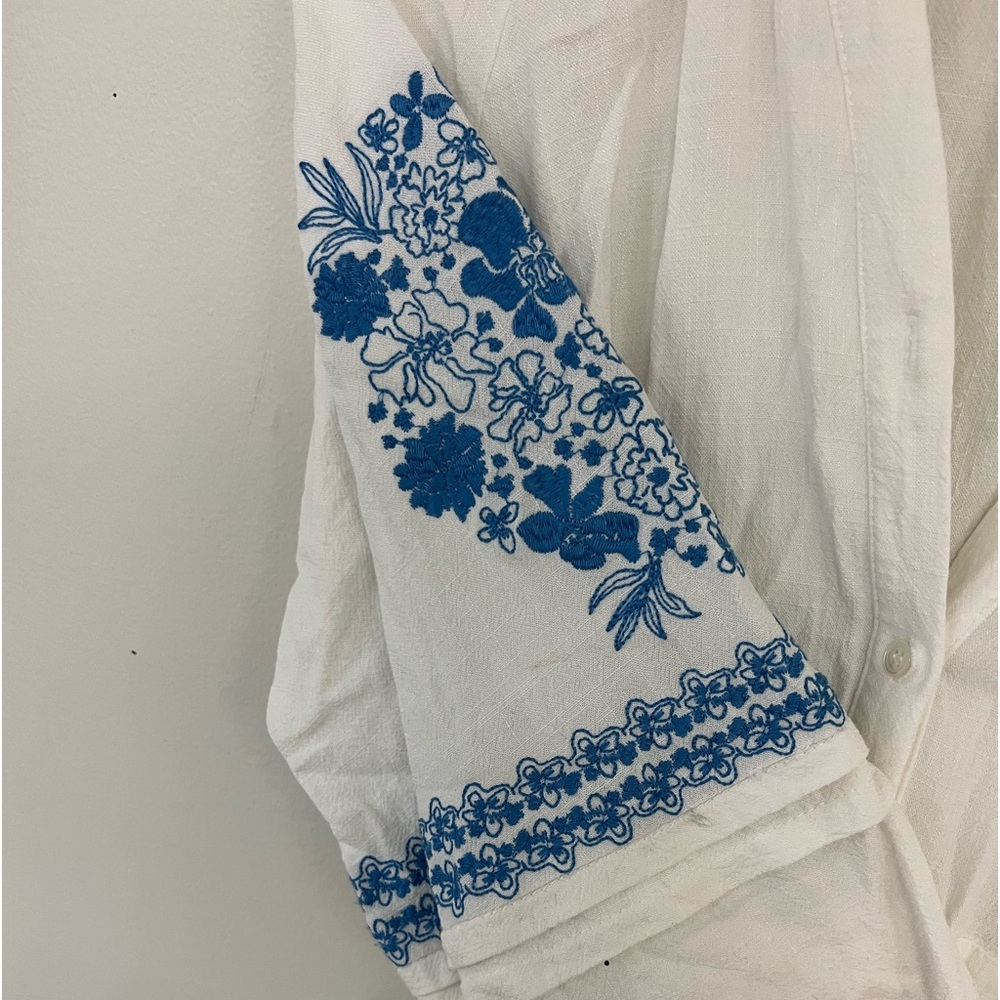 Woman’s blue and white embroidered linen dress